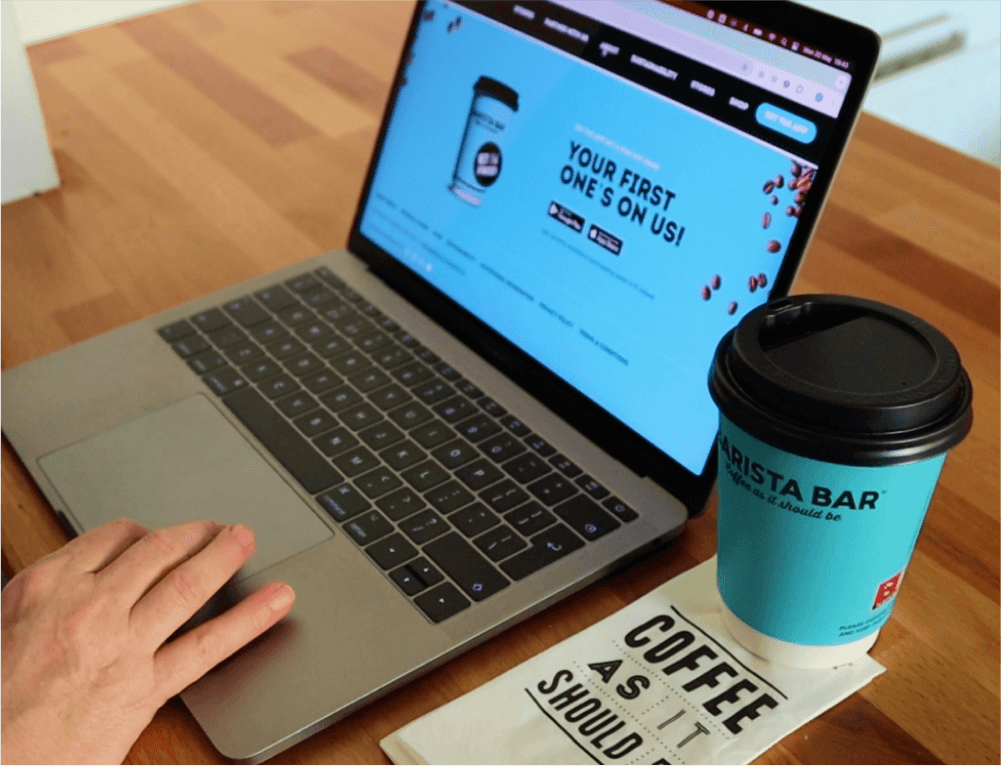 browsing the marketing website with a coffee