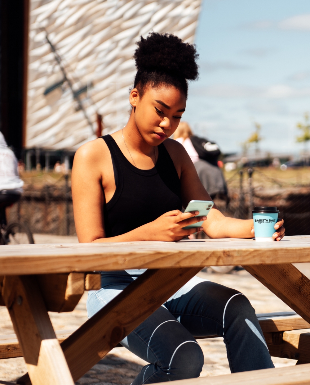 girl using app and drinking coffee