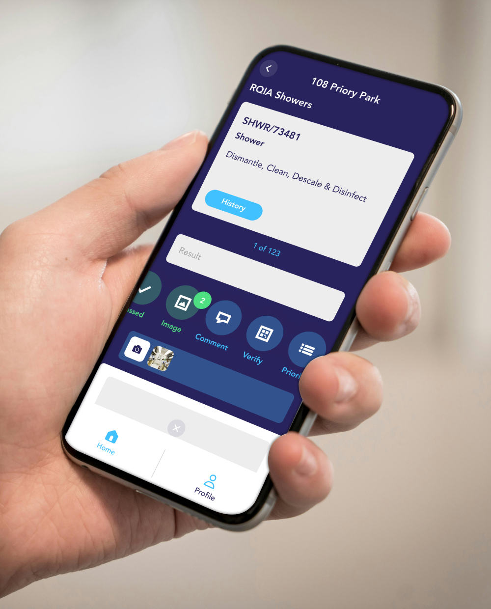 Hand holding phone with the app
