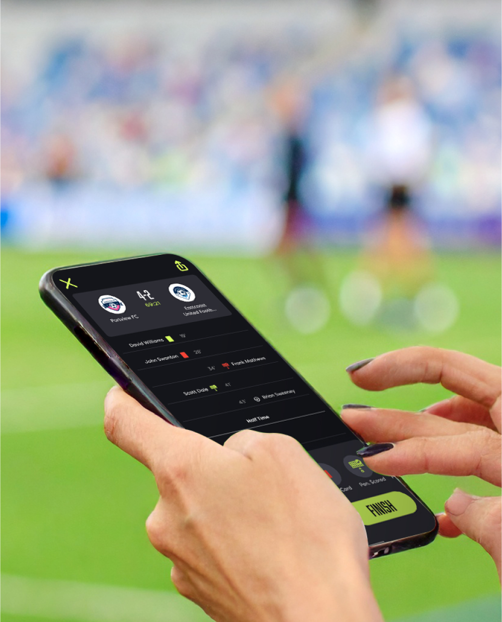 hand holding phone with the app on it at soccer game